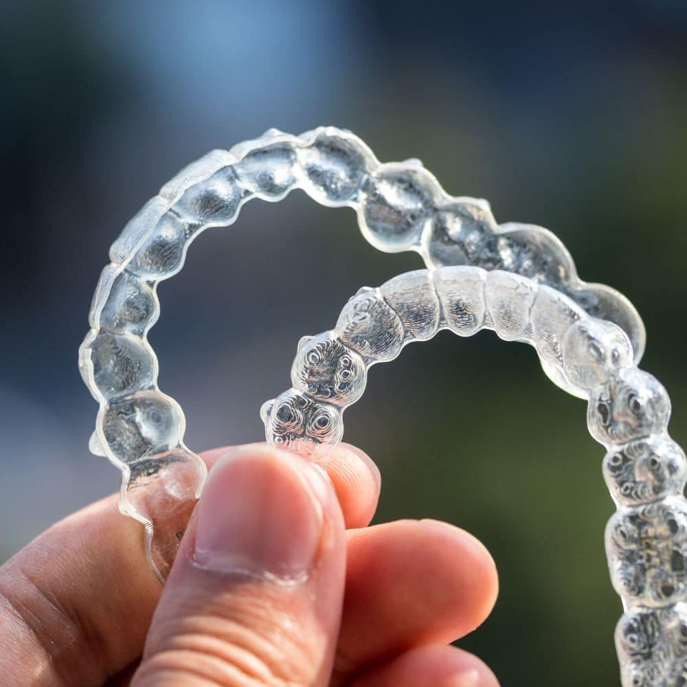 Invisible aligners held up